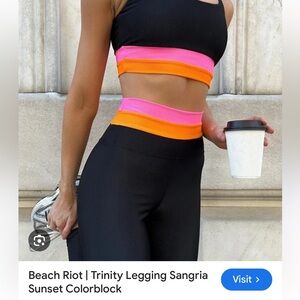 Beach Riot Trinity Leggings with Black, Pink, and Orange on top band